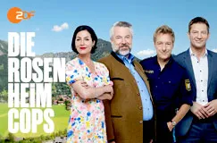 Texte: "DIE ROSENHEIM COPS". Vier Personen vor einem Hintergrund mit Bergen und blauem Himmel. ZDF-Logo oben links.