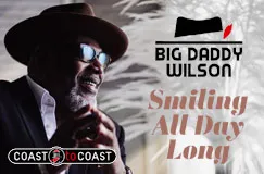 Text: "BIG DADDY WILSON", "Smiling All Day Long", Logo: Coast to Coast. Mann mit Hut und Sonnenbrille lächelt.