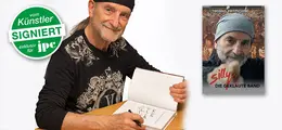 "Vom Künstler signiert exklusiv für jpc." Mann signiert Buch, Buchcover zeigt ihn mit Mütze und Text: "Thomas Fritzsching - Silly Die Geklaute Band".