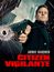 Text: „ARMIE HAMMER CITIZEN VIGILANTE“. Ein Mann in einem schwarzen Mantel hält eine Pistole. Hintergrund: Wolkenkratzer.