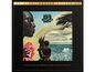 Albumcover "Miles Davis Bitches Brew". Links ein Profil, zentrale Themen: Natur, Meer, abstrakte Formen.