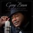 "George Benson, Inspiration: A Tribute to Nat King Cole." Bild eines lächelnden Mannes mit Mikrofon und Schallplatte.