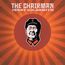 Text: "The Chairman, Jerry Goldsmith". Illustration eines stilisierten Mannes mit Mütze auf strahlenförmigem, rot-orangem Hintergrund.