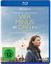 Text: "Blu-ray Disc", "Alamode Film", "Vier Minus Drei", "FSK ab 12". Frau im Profil, Luftballons, Menschen im Hintergrund.