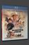 Text: "Kaktus Jack." Namen: Kirk Douglas, Ann-Margret, Arnold Schwarzenegger. Western-Szene mit Cowboy, Zug und Kutsche.