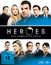 "HEROES DIE KOMPLETTE SERIE" steht in der Mitte mit einem halb verdeckten, schwarzen Kreis. Darunter Porträts von zwölf Personen.