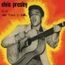 "elvis presley, il re del 'rock 'n' roll'" steht über einem schwarz-weißen Bild eines Sängers mit Akustikgitarre. Hintergrund: Rot-Gelb.