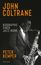 "JOHN COLTRANE" steht oben in Orange, darunter "BIOGRAFIE EINER JAZZ-IKONE". Unten "PETER KEMPER". Schwarz-weiß Foto mit Saxophon.
