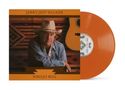 "Jerry Jeff Walker" und "Navajo Rug". Ein Mann mit Cowboyhut, Gitarre im Hintergrund, orangefarbene Schallplatte.