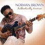 Text oben: "NORMAN BROWN Authentically Norman". Ein Mann spielt lächelnd Gitarre., CD