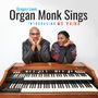 „Gregory Lewis Organ Monk Sings Introducing Ms Raina“; Zwei Personen lehnen an einer Hammond-Orgel und lächeln freundlich., CD