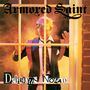 "Armored Saint" oben, "Delirious Nomad" unten; ein Mann in Anzug hinter einem Fenster, von buntem Licht umgeben., CD