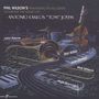Texte: "Phil Wilson's Panamerican All-Stars Celebrate the Music of Antonio Carlos 'Tom' Jobim", Namen von Musikern. Illustration: Instrumente und Straße., CD