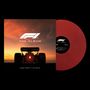 "F1 THE ALBUM" und "MUSIC FROM F1 THE MOVIE" auf einem Cover mit Formel-1-Auto und Sonnenuntergang. Rote Schallplatte.