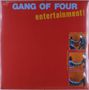 „GANG OF FOUR“ steht oben in Blau, „entertainment!“ darunter in Gelb. Illustration: Zwei Comic-Stil-Panels mit Händedruck., LP