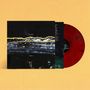 Vorderseite mit "Gilla Band" und "Postmillo". Darunter wellenförmige Linien in Gelb und Blau. Rote Vinyl-Schallplatte., LP