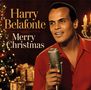 "Harry Belafonte Merry Christmas" steht in eleganter Schrift. Ein Mann in rotem Hemd hält ein Mikrofon vor einem Weihnachtsbaum.