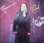 Der Text lautet "Ana Gabriel En Vivo". Eine Sängerin auf der Bühne mit Mikrofon, sie trägt ein schwarzes Outfit; Musiker im Hintergrund., 2 LPs
