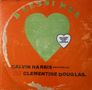Texte: "BLESSINGS", "CALVIN HARRIS", "CLEMENTINE DOUGLAS", "RECORD STORE DAY EDITION". Ein grünes Herz auf orangem Hintergrund., LP
