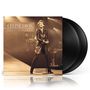 "CÉLINE DION LIVE À PARIS" steht auf einem Albumcover. Im Hintergrund singt eine Frau in einem langen Mantel auf der Bühne., 2 LPs