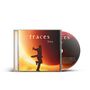 "traces live". Silhouette eines springenden Mannes vor großem, leuchtendem Sonnenuntergangshintergrund. CD-Hülle und Disc., CD