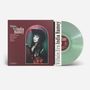 Text: "Villain Era India Ramey". Liste: 10 Songtitel. Foto: Frau mit Cowboyhut, bunte Jacke. Transparente, grüne Vinyl., LP