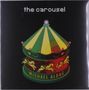 Text: "the carousel" oben, "MICHAEL ALDAG" unten. Illustration eines Karussells mit grünen und gelben Paneelen und Pferden., LP