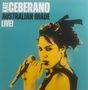 Text: "KATE CEBERANO AUSTRALIAN MADE LIVE!" Eine Frau mit Mikrofon in der Hand, grafisch in Gelb und Schwarz vor türkisfarbenem Hintergrund.
