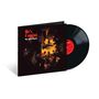„He's Coming“ und „Roy Ayers Ubiquity“ sind in leuchtendem Rot auf einem Cover mit dunklen, warmen Farben zu sehen.