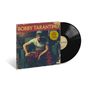 "Bobby Tarantino" und Hinweis auf Logics 10-jähriges Jubiläum. Mann in roter Hose auf Plattencover., LP