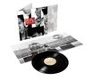 Text: "Simple Minds Once Upon a Time". Zu sehen ist ein Schallplattencover und eine Vinyl-Schallplatte mit Konzertfoto., LP