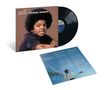 „The Definitive Collection – Michael Jackson.“ Schwarze Schallplatte mit Cover eines jungen Michael Jacksons und einem Textblatt., LP