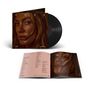 Texte: "PURE", "DELTA" und "GOODREM". 
Ein Schallplatten-Cover mit dem Porträt einer Frau und einem geöffneten Booklet mit Songtexten., LP