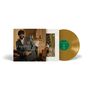 "Gregory Porter - Christmas Wish." Eine elegante Schallplatte in Gold. Cover mit schick gekleidetem Mann vor Weihnachtsszene., LP
