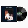 Text: "Philip Lynott" und "Fatalistic Attitude". Ein Mann im Anzug spielt Schach, raucht, mit einer Vinyl-Schallplatte daneben., LP