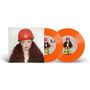 "The giver". Eine Frau mit rotem Helm ist auf einem Albumcover zu sehen, daneben zwei orangefarbene Schallplatten., Single 7"