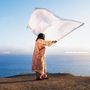 Text: "ELMIENE" und "sounds for someone". Person in buntem Gewand hält ein großes Tuch am Meer., CD