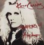 Oben steht „Kim Carnes”, unten „Barking at Airplanes”. Eine Person mit langem, blondem Haar blickt ernst., CD