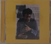 Ein Cover in Gelb mit einer mittigen Fotografie. Darauf ein Mann in einem dunklen Hemd, der mit den Händen gestikuliert., CD