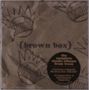 Text: "(brown box)", "the complete studio albums from ween". Illustration von lächelnden, krönchenartigen Gesichtern., 10 CDs