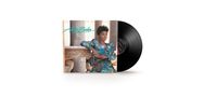 Vor einem Vinylalbum steht „Anita Baker“ in türkis. Es zeigt eine Frau in blauer Kleidung, die an einem Säulenbeet lehnt.