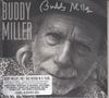 Text: "Buddy Miller". Ein älterer Mann mit Bart und Hut, Nahaufnahme, trägt eine gemusterte Jacke. Schwarz-weißes Foto., CD