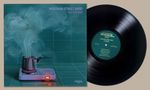 "Menahan Street Band", "Illusions". Illustration: Dampf aus Kochtopf formt Gesichter, neben einer Schallplatte., LP