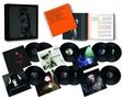 Eine Sammlung von Vinyl-Schallplatten mit Albumcovern. Ein orangener Text "PETER MURPHY LAYING ON NEW WAVES THE 2000s COLLECTION"., 9 LPs