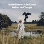 „Avalon Emerson & the Charm, Written into Changes“. Eine Person in weißer Kleidung hält einen Greifvogel auf einer Wiese., CD