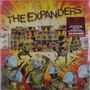 „THE EXPANDERS“ steht in großen Buchstaben. Illustration von Polizisten und Musikern vor einem Turm aus Lautsprechern., LP