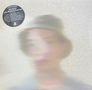 Ein verschwommenes Gesicht ist sichtbar. Oben links steht: "Devon Hynes, New Beliefs on Lagrange", darunter ein beschreibender Text., LP