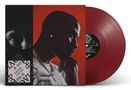 Texte: "Chaos is my lad." Porträt eines nachdenklichen Mannes, daneben eine Schallplatte mit rotem Vinyl., LP