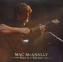 "MAC McANALLY - Once in a Lifetime." Ein Mann spielt sanft Gitarre in gedämpftem Licht, sein Gesicht teils beschattet., LP