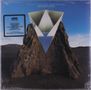 "Giraffe Tongue Orchestra - Broken Lines". Eine geometrische Illustration über einem Felsen in einer Landschaft., LP
